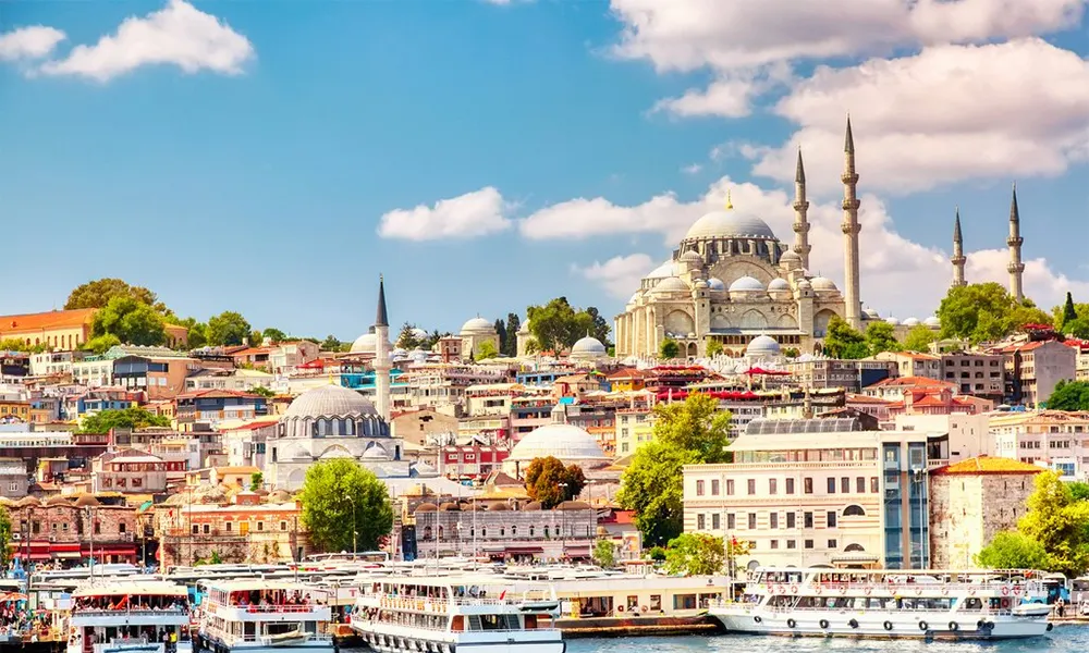 The Istanbul skyline with a domed mosque and minarets rising above the waterfront, Turkey.