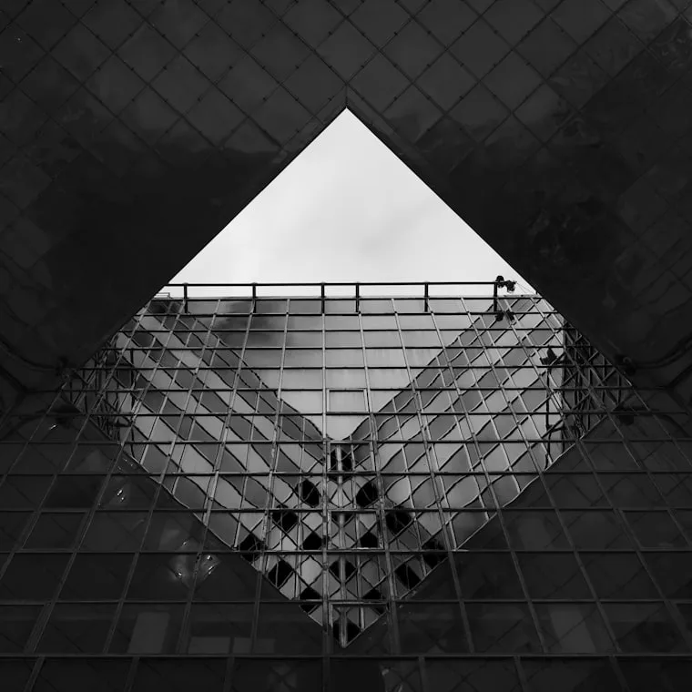 Looking up through a diamond aperture in a glazed roof.